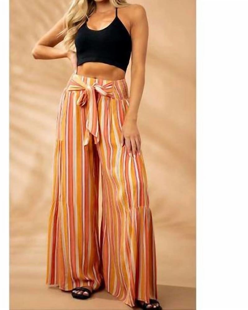 Front of a model wearing a size L Striped Front Tie Flowy Wide Leg Pants in Multi in Multi by ANGIE. | dia_product_style_image_id:340003